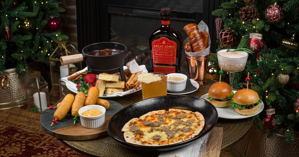 A Bottle of Great Jones with an assortment of foods